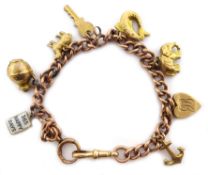 9ct rose gold curb chain bracelet, stamped 9 375, with eight charms,