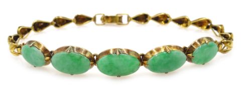 Gold leaf design link bracelet, set with oval jade stones,