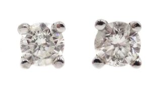 Pair of 18ct white gold diamond stud earrings, stamped 750, diamonds approx 0.