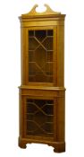 Graduated pair of 20th century golden oak standing corner cabinets,