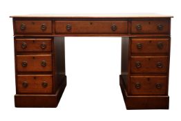 Early 20th century oak knee hole desk, moulded top with inset green tooled leather writing surface,