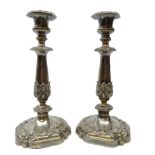 Pair Victorian Sheffield plate candlesticks of tapering form cast in relief with acanthus leaves