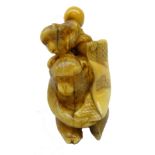 Japanese Meiji ivory Okimono carved as two Monkeys holding a banner, H6.