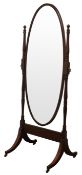 Edwardian inlaid mahogany Cheval mirror, with oval plate on ring turned supports,