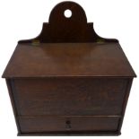 19th century oak wall mounted candle box, the slope hinged cover with two section interior,