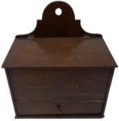 19th century oak wall mounted candle box, the slope hinged cover with two section interior,