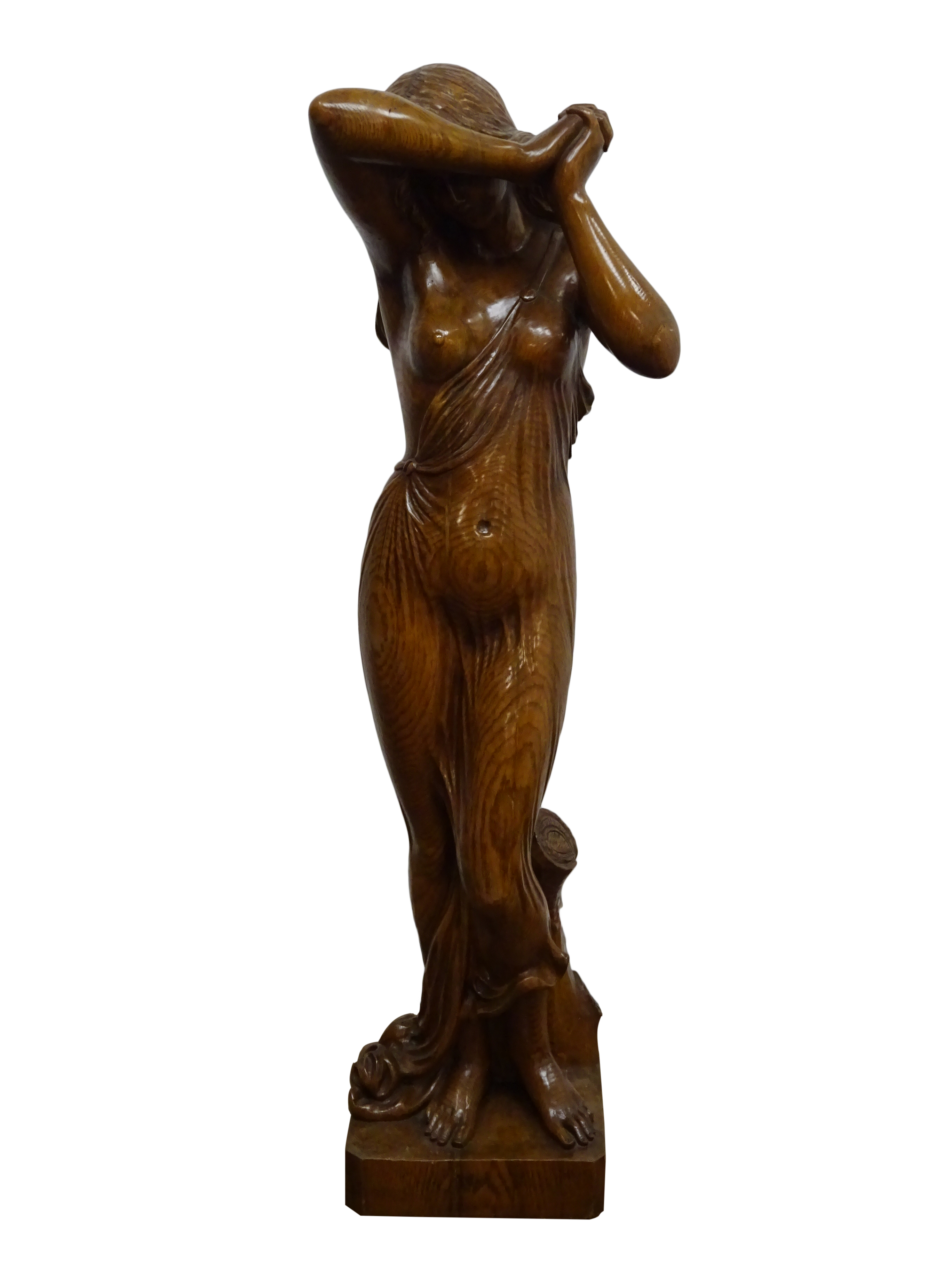 Large carved figured oak model of a diaphanously draped young woman,