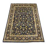 Persian Kashan rug carpet, blue ground field with scrolling foliate and stylised flower heads,