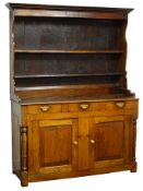 George III oak dresser, moulded cornice above two shelves,
