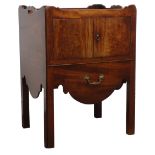 George lll mahogany bedside cupboard with gallery top and two doors above a sliding drawer,