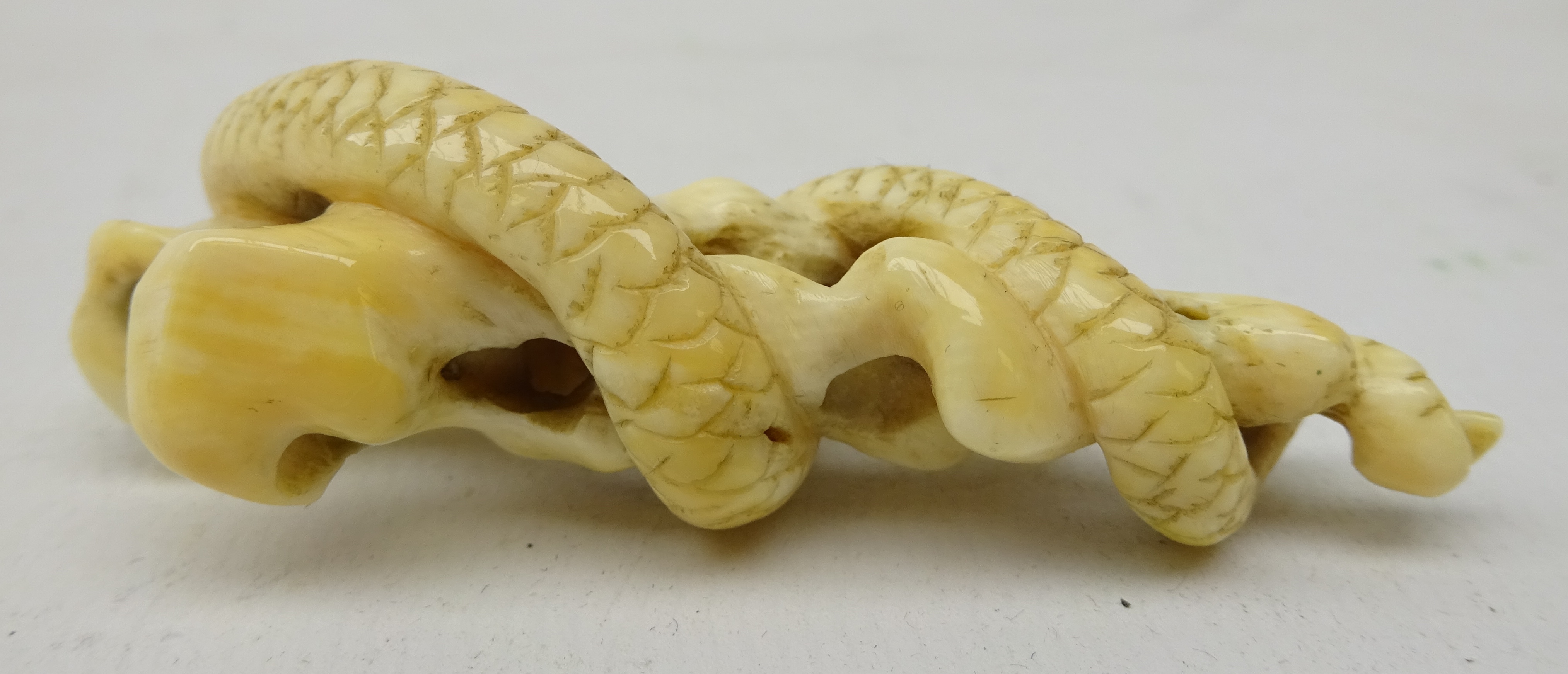 Japanese Meiji ivory Okimono carved has a Snake coiled around rock work, L6. - Image 3 of 3