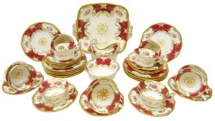 Early 20th century Coalport Batwing red ground tea service comprising twelve tea cups & saucers,