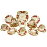 Early 20th century Coalport Batwing red ground tea service comprising twelve tea cups & saucers,