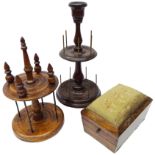 19th century mahogany two tier cotton reel stand on turned stem, circular base with four bun feet,