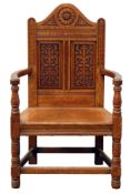 Late Victorian oak armchair, curved arch cresting rail carved with flower head,