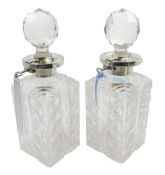 Pair of silver mounted cut glass decanters,