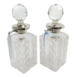 Pair of silver mounted cut glass decanters,