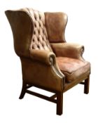Large George lll style brass nailed leather wingback armchair,