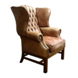 Large George lll style brass nailed leather wingback armchair,