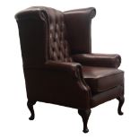 George lll style wingback armchair, upholstered in deep buttoned brown leather on cabriole legs,