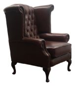 George lll style wingback armchair, upholstered in deep buttoned brown leather on cabriole legs,