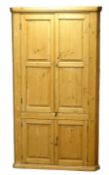18th century country pine corner cupboard, shelved interior enclosed by four fielded panelled doors,