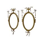 Pair of Edwardian Adam Revival carved gilt wood and gesso wall mirrors,
