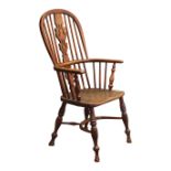 Early 19th century ash and elm high back Windsor armchair, shaped pierced splat and stick back,