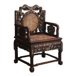 Chinese Qing period Padouk wood armchair, pierced and carved with dragons and foliage,