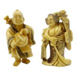 Two Japanese carved ivory Netsukes, both playing musical instruments, signed,