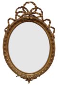 Large 19th century Adam style oval gilt wood and gesso framed wall mirror,