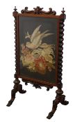 Victorian walnut firescreen with scroll carved cresting,