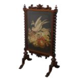 Victorian walnut firescreen with scroll carved cresting,