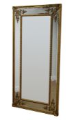 Regency style gilt framed rectangular mirror, bevelled sectional plate with bead,