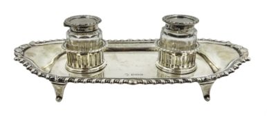 Silver inkstand of shaped rectangular form, gadroon border,