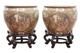 Pair of large Cantonese style Famille Rose fish bowls,