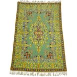 An Iranian lined silk tapestry wall hanging, the central oblong panel with floral motif in purple,