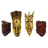 Two 19th/ early 20th century African carved bone face masks,