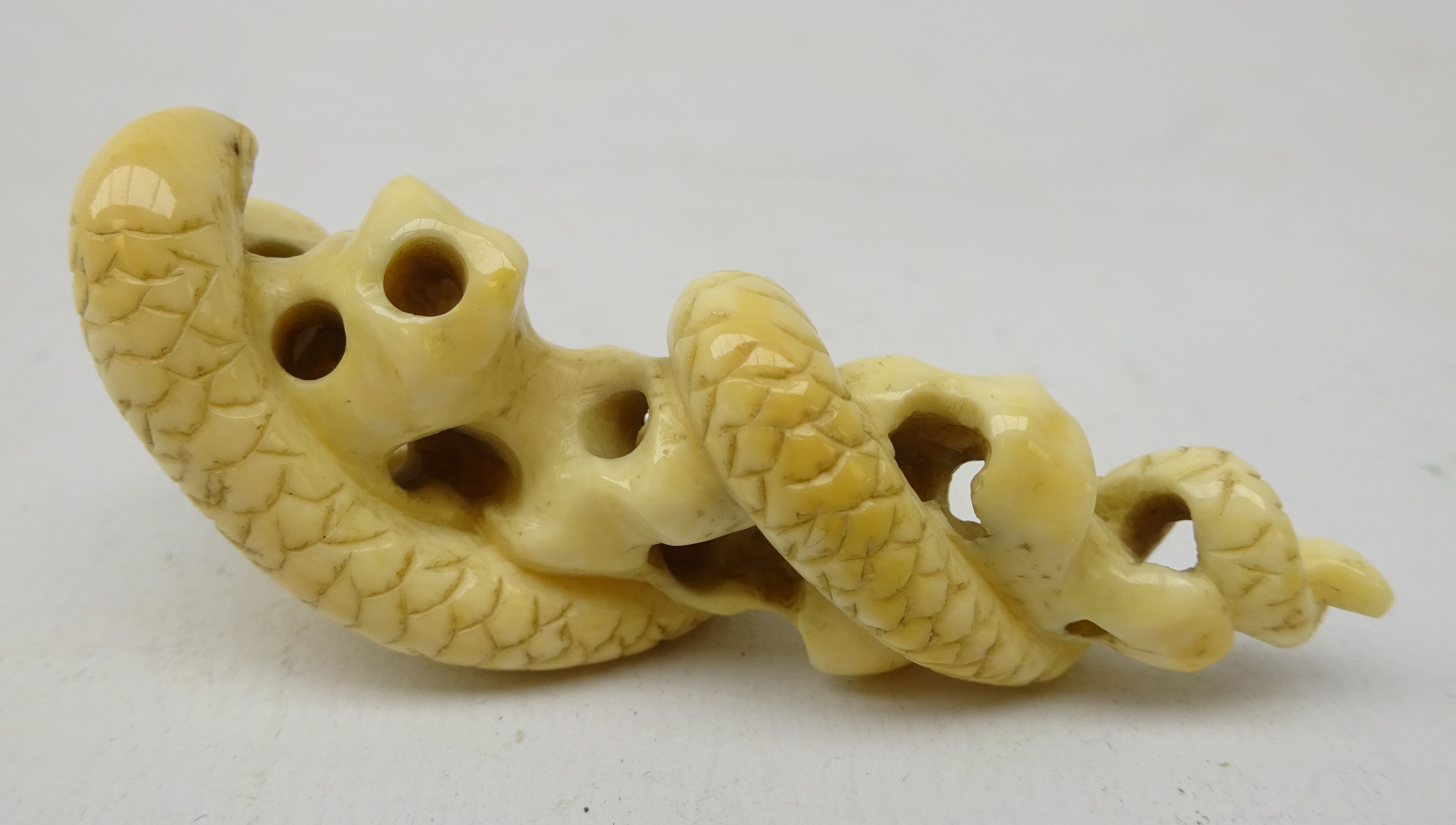 Japanese Meiji ivory Okimono carved has a Snake coiled around rock work, L6. - Image 2 of 3