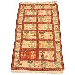 An Afghan hand woven silk rug,