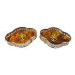 Pair quatrefoil simulated tortoise shell bottle coasters with silver-plate gallery and brass inlay,