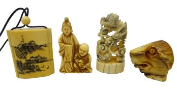 Two Japanese Meiji carved ivory Netsukes,