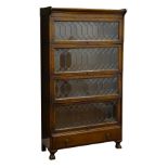 Early 20th century oak Gunn Sectional Bookcase, the four tiers with leaded glass doors,