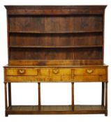 18th century oak dresser, twin shelf back with moulded cornice and dentil frieze with iron hooks,
