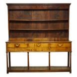 18th century oak dresser, twin shelf back with moulded cornice and dentil frieze with iron hooks,