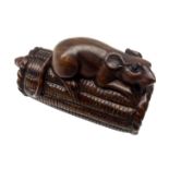 Japanese Meiji boxwood Netsuke carved as a rat perched on top of a rice bail and another rat below,