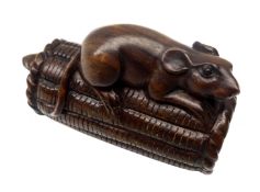 Japanese Meiji boxwood Netsuke carved as a rat perched on top of a rice bail and another rat below,