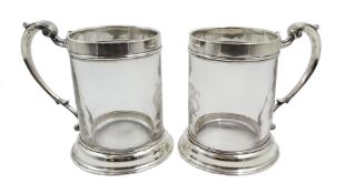 Pair Victorian glass and silver mounted tankards, scroll handle with etched monogram,