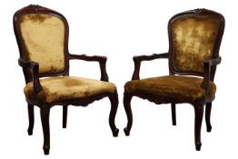 Pair of French open armchairs, moulded frames with floral carved cresting,