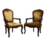 Pair of French open armchairs, moulded frames with floral carved cresting,